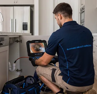 Clearing a blocked sink at a Cheltenham property